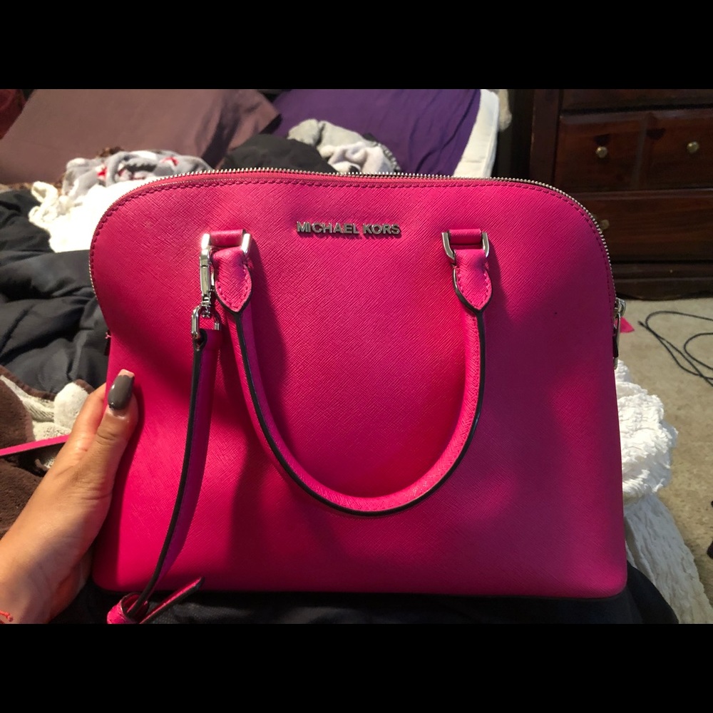 Bright pink Michael Kors purse